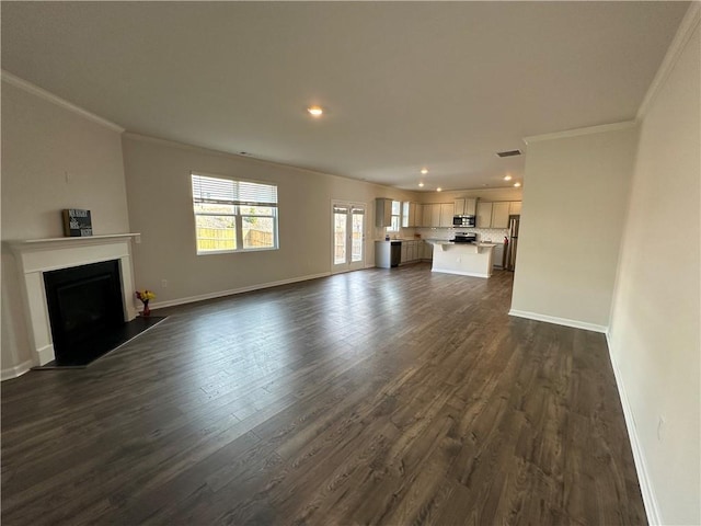 unfurnished living room with dark hardwood / wood-style flooring and crown molding