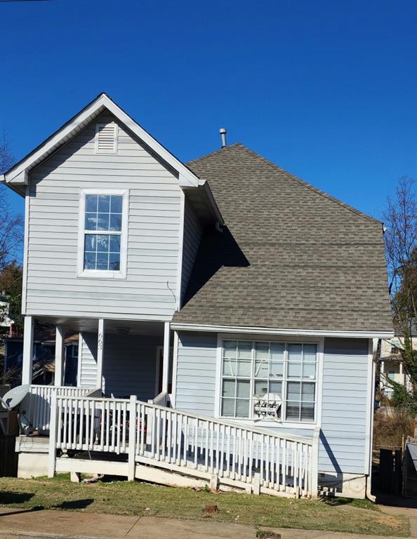 back of property featuring covered porch