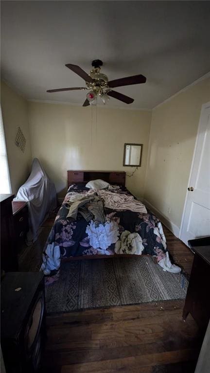 bedroom with ceiling fan and hardwood / wood-style floors