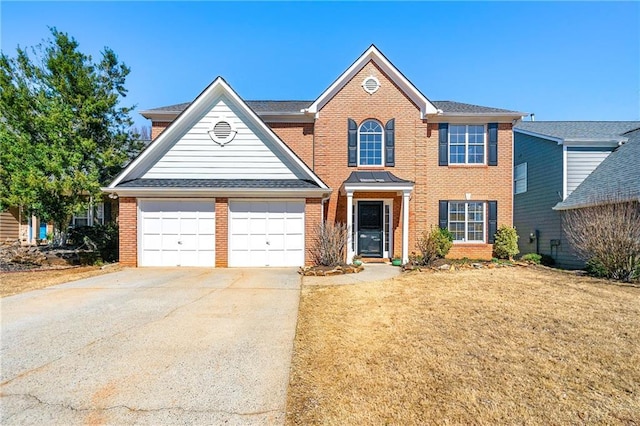 view of front of home with a front yard, brick siding, driveway, and an attached garage