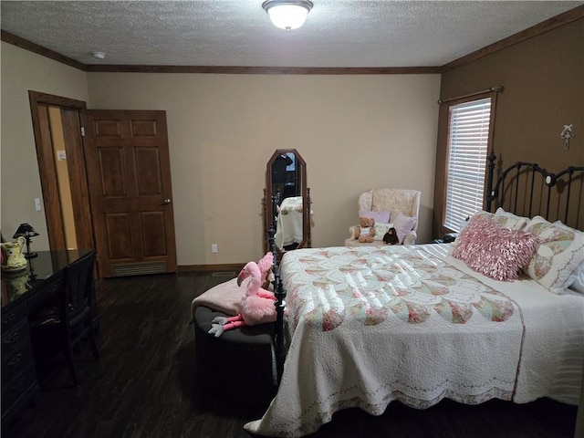 bedroom featuring baseboards, a textured ceiling, ornamental molding, and dark wood-style flooring