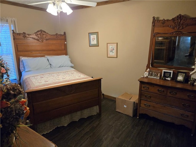 bedroom featuring dark wood-type flooring and a ceiling fan