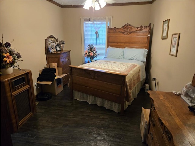 bedroom with ceiling fan and dark wood-type flooring