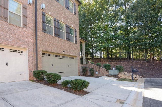 view of property exterior featuring a garage