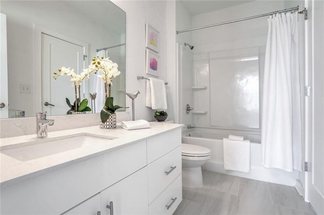 full bathroom featuring toilet, vanity, and shower / tub combo