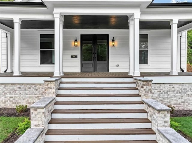 property entrance with french doors and a porch