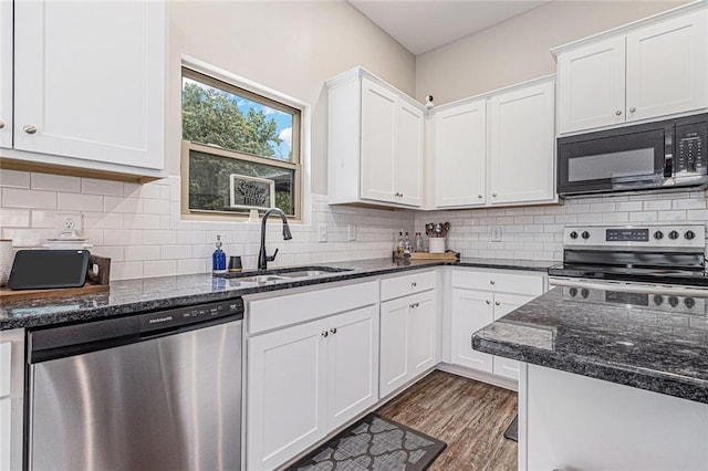 1549 Miller Valley Dr, Bethlehem, GA 30620 - kitchen with stainless steel appliances, a sink, white cabinets, dark stone counters, and tasteful backsplash
