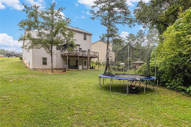 1549 Miller Valley Dr, Bethlehem, GA 30620 - view of grassy yard with a trampoline and a wooden deck