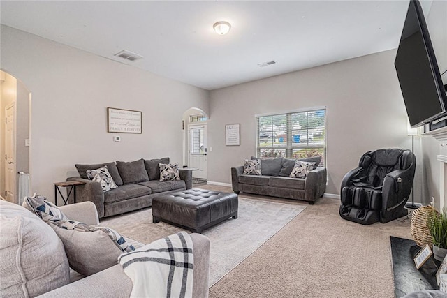 1549 Miller Valley Dr, Bethlehem, GA 30620 - living area with arched walkways, light carpet, and baseboards