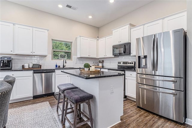 1549 Miller Valley Dr, Bethlehem, GA 30620 - kitchen featuring stainless steel appliances, a sink, white cabinets, dark wood-style flooring, and recessed lighting