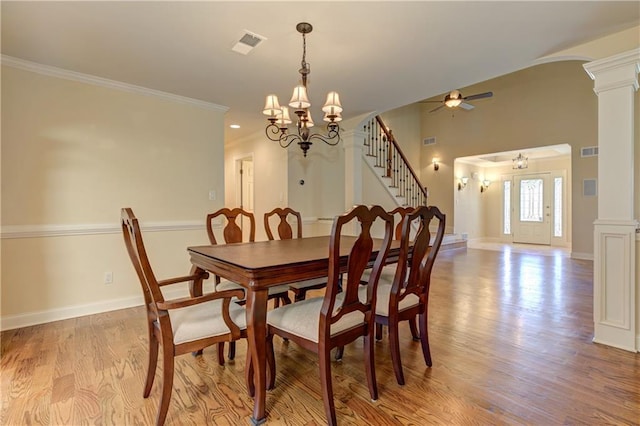 dining room with ornamental molding, decorative columns, visible vents, and light wood-type flooring