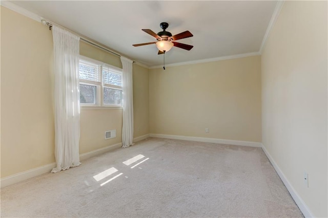 carpeted empty room featuring visible vents, ceiling fan, baseboards, and ornamental molding