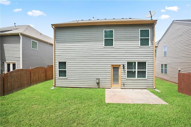 rear view of property featuring a patio area