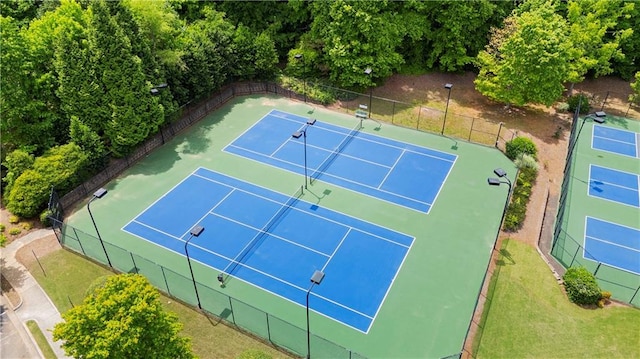 view of tennis court with fence