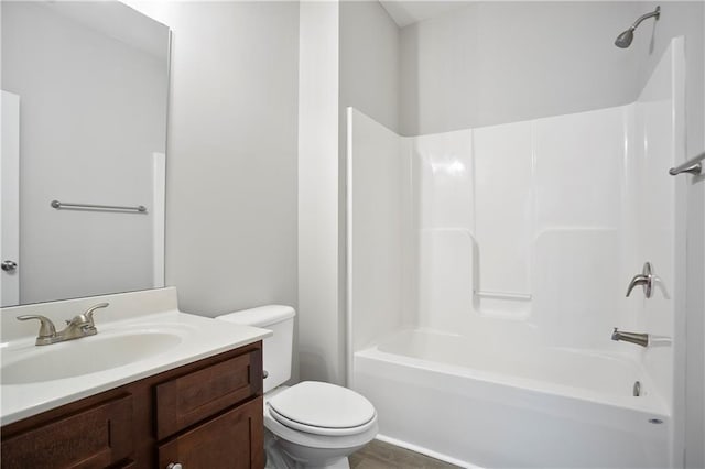 full bathroom with toilet, bathing tub / shower combination, and vanity