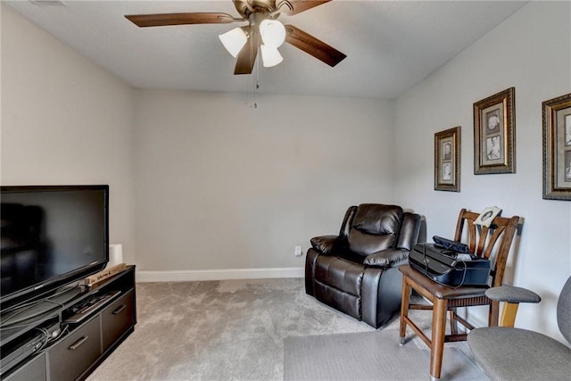 living area featuring light carpet