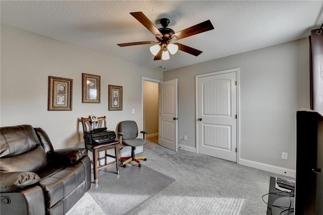 office with ceiling fan, light colored carpet, and a textured ceiling