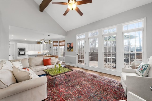 living area featuring ceiling fan, high vaulted ceiling, recessed lighting, light wood-style floors, and beamed ceiling