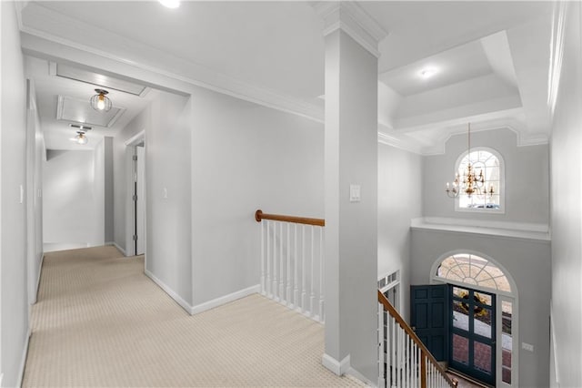 hall with carpet floors, baseboards, and an upstairs landing