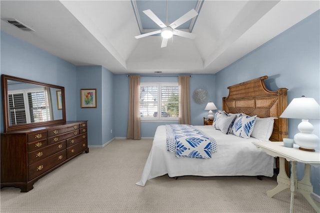 bedroom with lofted ceiling, ceiling fan, carpet floors, visible vents, and baseboards