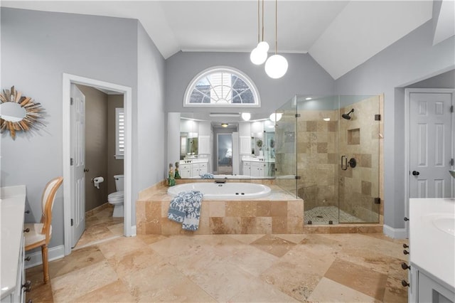 full bathroom featuring a garden tub, toilet, vanity, vaulted ceiling, and a shower stall