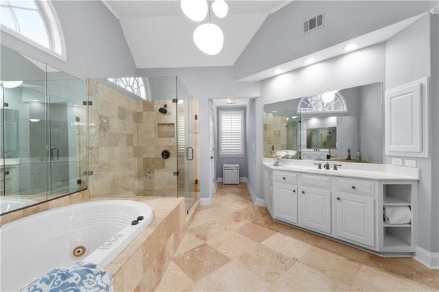 full bathroom featuring lofted ceiling, a shower stall, visible vents, and a whirlpool tub