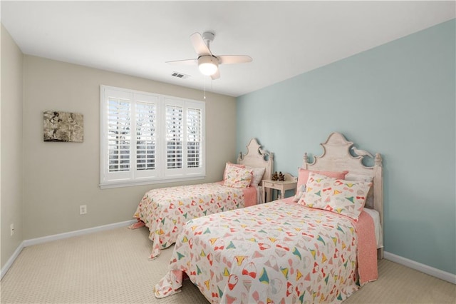 bedroom with carpet flooring, ceiling fan, visible vents, and baseboards