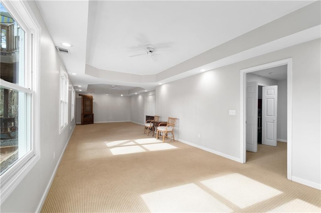 unfurnished room featuring recessed lighting, light carpet, and baseboards