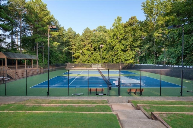 view of tennis court with fence