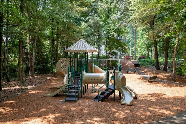 community play area with a view of trees