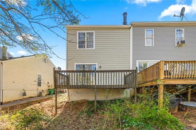 back of house featuring a deck and central AC