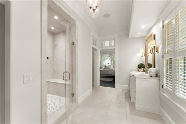 bathroom with an enclosed shower, vanity, tile patterned flooring, and crown molding