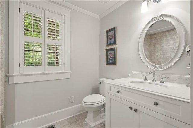 bathroom featuring toilet, vanity, ornamental molding, and tile patterned flooring