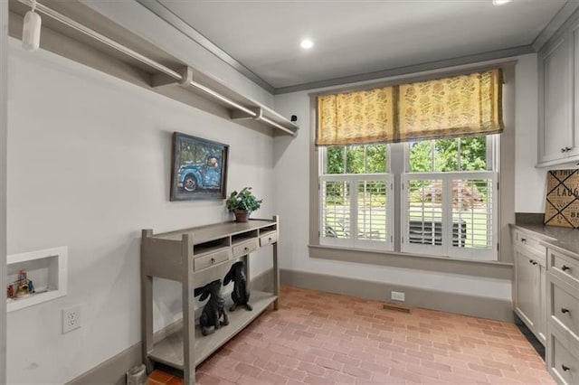 interior space featuring ornamental molding