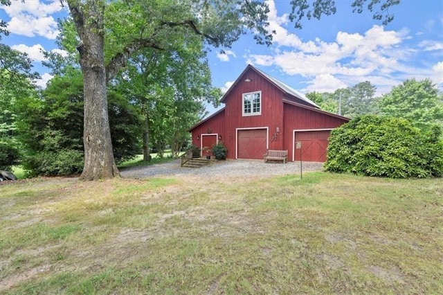 view of outbuilding with a yard