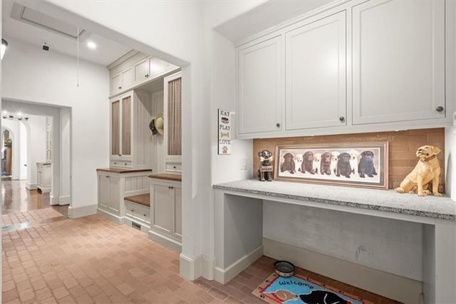 mudroom featuring built in desk