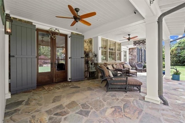 view of patio / terrace featuring ceiling fan and french doors