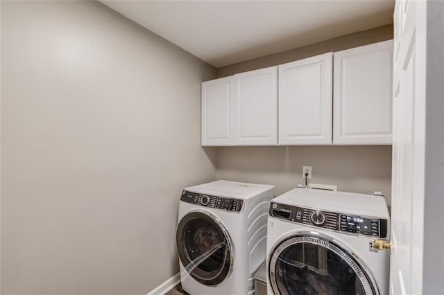 laundry area with cabinets and independent washer and dryer