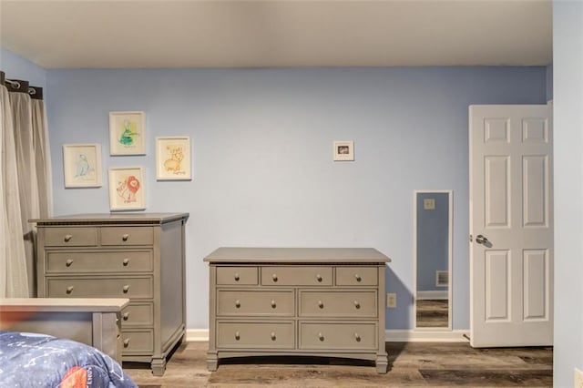 bedroom with light hardwood / wood-style flooring