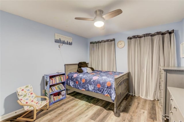 bedroom featuring ceiling fan and light wood-type flooring