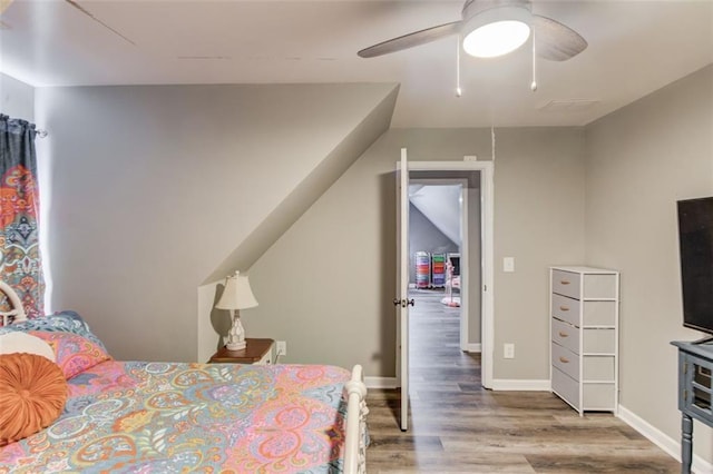 bedroom featuring ceiling fan and wood-type flooring