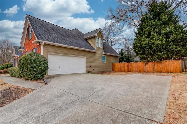 view of side of property with a garage