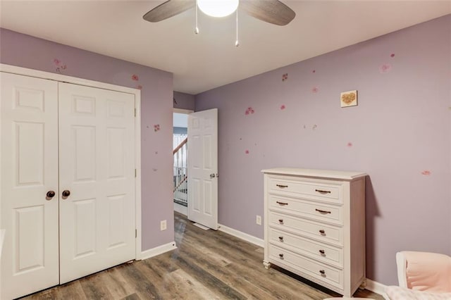 bedroom featuring a closet, ceiling fan, and hardwood / wood-style flooring