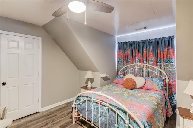 bedroom featuring lofted ceiling, hardwood / wood-style floors, and ceiling fan