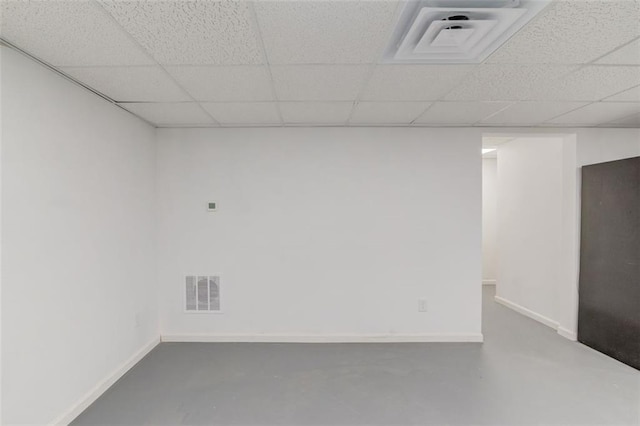 basement featuring a paneled ceiling