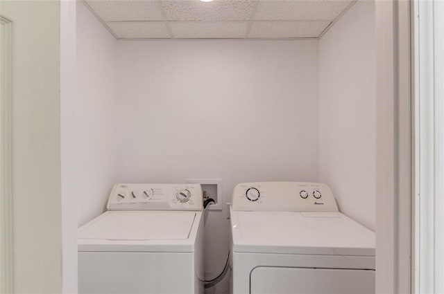 laundry room featuring washing machine and clothes dryer