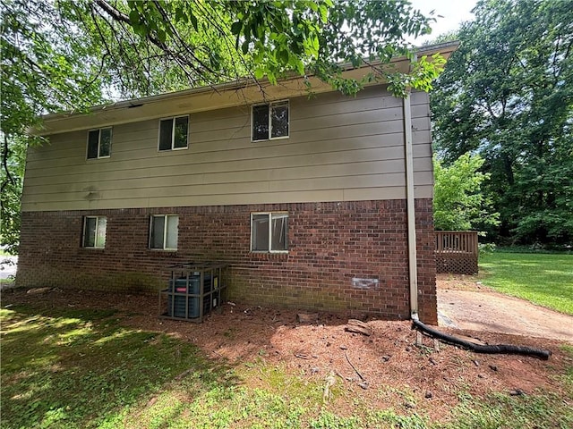 4135 Moore Rd, Conley, GA 30288 - view of side of property featuring brick siding and a yard