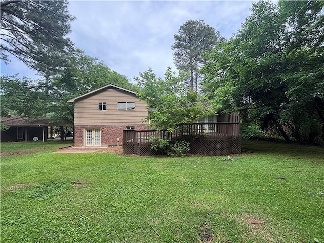 4135 Moore Rd, Conley, GA 30288 - rear view of property with a deck, a lawn, french doors, and brick siding