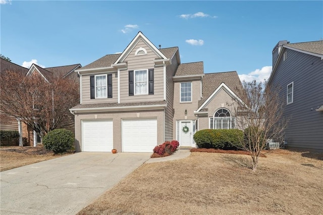 front facade with a garage and a front yard