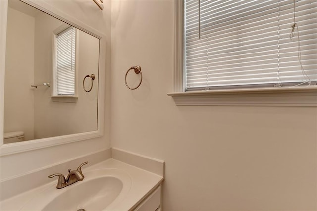 580 Hammersmith Dr, Suwanee, GA 30024 - half bath featuring vanity and toilet